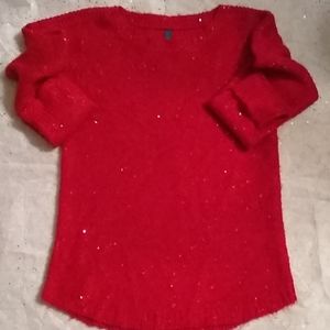 Red sweater with red sequence.